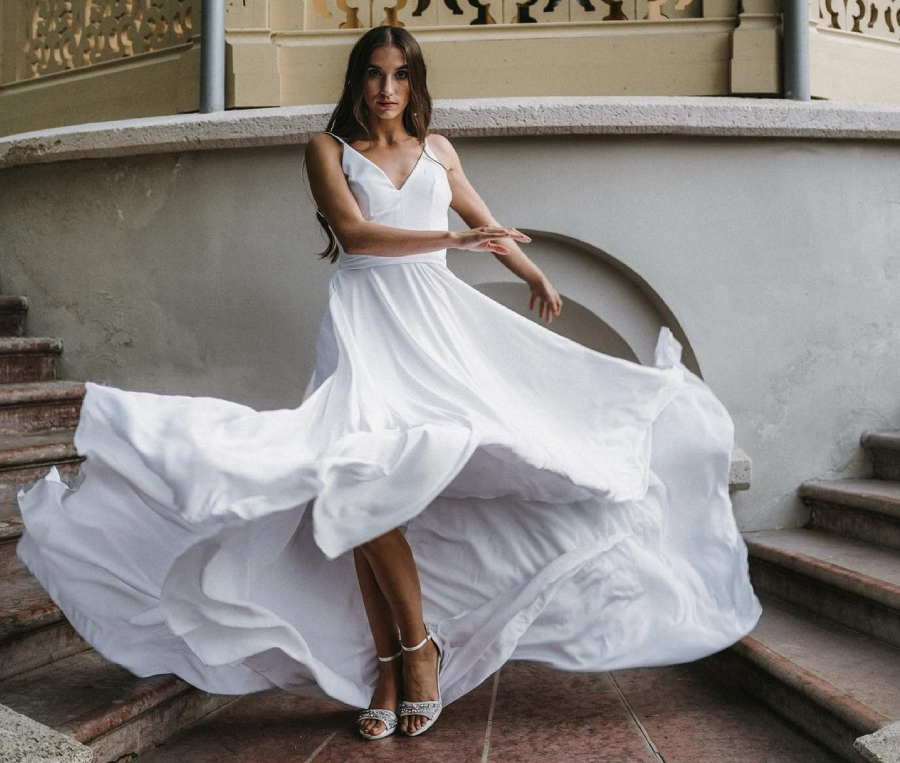 Model wearing a winter formal dress.