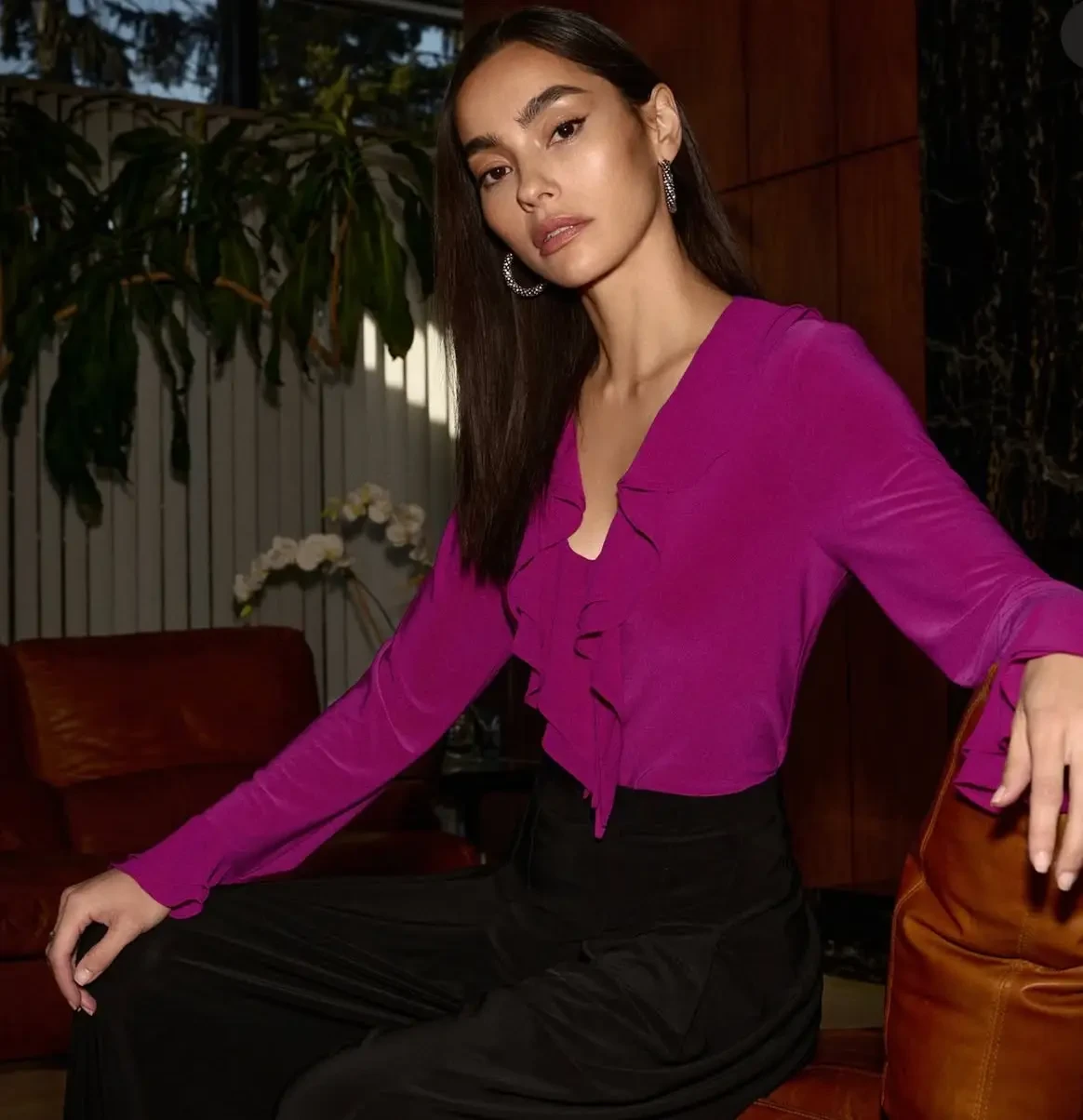 model wearing purple shirt